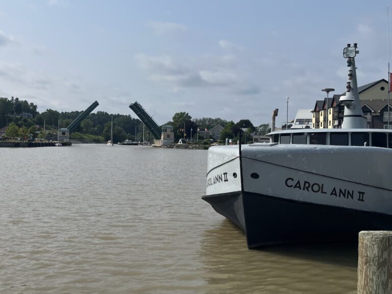 The fish tug Carol Ann II moored on Kettle Creek at Port Stanley, with the King George VI lift bridge raised in the background