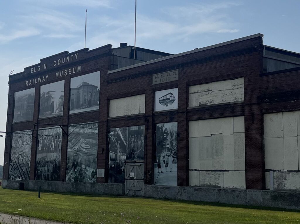 Elgin County Railway Museum building in St. Thomas with historic black-and-white photo murals covering its trackside windows