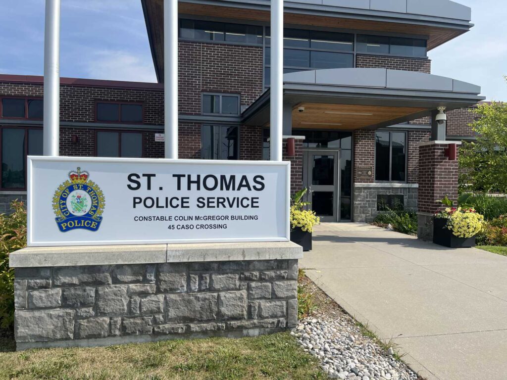 Sign at the St. Thomas Police Service headquarters reading Constable Colin McGregor Building, 45 Caso Crossing, with the service crest