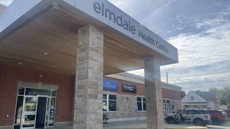 Front entrance of the Elmdale Health Centre at 25 Elm Street in St. Thomas, with the TMC+ and Lifemark Physiotherapy signs under the canopy